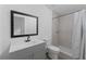 Clean bathroom with gray tile shower and modern vanity at 920 S Solandra Dr, Orlando, FL 32807