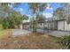 Spacious backyard with a screened-in pool at 920 S Solandra Dr, Orlando, FL 32807