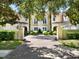 Elegant two-story home with brick driveway and lush landscaping at 10323 Kensington Shore Dr # 201, Orlando, FL 32827