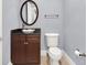 Elegant powder room with a pedestal sink and dark wood vanity at 10323 Kensington Shore Dr # 201, Orlando, FL 32827