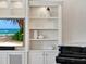 Custom built-in shelving with ample storage and display space at 10323 Kensington Shore Dr # 201, Orlando, FL 32827