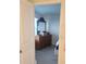 Bright bedroom with wood dresser and large mirror at 402 Quarry Rock Cir, Kissimmee, FL 34758