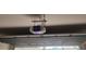 Chamberlain garage door opener installed on the ceiling at 402 Quarry Rock Cir, Kissimmee, FL 34758