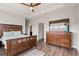 Spacious bedroom with wood flooring and large dresser at 594 Piazza Pt, Oviedo, FL 32765