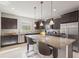 Spacious kitchen with granite countertops and stainless steel appliances at 594 Piazza Pt, Oviedo, FL 32765