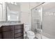 Modern bathroom with granite vanity and walk-in shower at 594 Piazza Pt, Oviedo, FL 32765