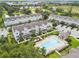 Aerial view of townhouses with a community pool at 594 Piazza Pt, Oviedo, FL 32765