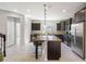 Modern kitchen with granite island and stainless steel appliances at 594 Piazza Pt, Oviedo, FL 32765