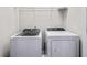Laundry room with Whirlpool washer and dryer, and overhead shelving at 594 Piazza Pt, Oviedo, FL 32765