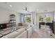 Living room with sectional sofa and access to balcony at 594 Piazza Pt, Oviedo, FL 32765