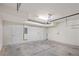 Empty garage with white walls and concrete floor at 594 Piazza Pt, Oviedo, FL 32765