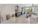 Bright living room featuring a comfortable sectional sofa and large windows at 594 Piazza Pt, Oviedo, FL 32765