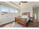 Bright bedroom with wood flooring and king-size bed at 594 Piazza Pt, Oviedo, FL 32765
