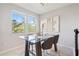 Breakfast nook with glass table and modern decor at 594 Piazza Pt, Oviedo, FL 32765