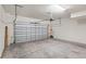 Garage with open garage door, offering ample storage space at 594 Piazza Pt, Oviedo, FL 32765