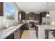 Modern kitchen with granite countertops and ample cabinet space at 594 Piazza Pt, Oviedo, FL 32765
