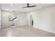 Spacious living area with stairs and tile flooring at 594 Piazza Pt, Oviedo, FL 32765