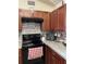 Well-equipped kitchen with electric range and built-in microwave at 4644 Glencrest Loop, Saint Cloud, FL 34772