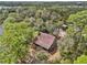 Aerial view of a rustic home with a large yard near the water at 2459 Adelia Blvd, Deltona, FL 32725