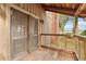 Rustic screened porch with wooden flooring and water views at 2459 Adelia Blvd, Deltona, FL 32725