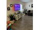 Living room with a TV, grey sofas, and vinyl flooring at 4743 S Texas Ave # 4743B, Orlando, FL 32839