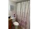 Clean bathroom with shower/tub and patterned curtain at 4743 S Texas Ave # 4743B, Orlando, FL 32839