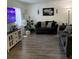 Living room with grey sofas, a TV, and vinyl flooring at 4743 S Texas Ave # 4743B, Orlando, FL 32839