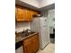 Kitchen with double sink, granite countertop and refrigerator at 4743 S Texas Ave # 4743B, Orlando, FL 32839