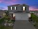 Two-story house with landscaped front yard at 1008 Overlook Ct, Davenport, FL 33837