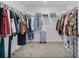 Large walk-in closet with ample hanging space and shelving at 1008 Overlook Ct, Davenport, FL 33837
