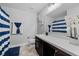 Bathroom boasts a dark vanity, shower, and toilet at 1008 Overlook Ct, Davenport, FL 33837