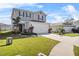 Two-story house with landscaped front yard at 1008 Overlook Ct, Davenport, FL 33837