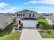 Two-story house with landscaped front yard at 1008 Overlook Ct, Davenport, FL 33837
