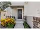 Inviting front entry with stone accents and lush landscaping at 1008 Overlook Ct, Davenport, FL 33837