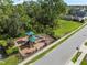 Community playground with shaded structures and play equipment at 1008 Overlook Ct, Davenport, FL 33837