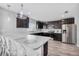 Modern kitchen with breakfast bar and stainless steel appliances at 1008 Overlook Ct, Davenport, FL 33837