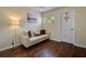 Bedroom with light walls, hardwood floors, and a comfortable sofa at 221 Las Fuentes Dr, Kissimmee, FL 34746