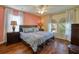 Spacious main bedroom with hardwood floors and a king-size bed at 221 Las Fuentes Dr, Kissimmee, FL 34746