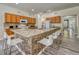 Spacious kitchen island with seating and granite countertops at 221 Las Fuentes Dr, Kissimmee, FL 34746