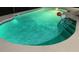 Relaxing kidney-shaped pool at night at 221 Las Fuentes Dr, Kissimmee, FL 34746