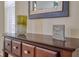 Console table with decorative vase and framed sign at 221 Las Fuentes Dr, Kissimmee, FL 34746