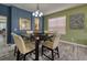 Charming dining room with a square table, four chairs and hardwood floors at 221 Las Fuentes Dr, Kissimmee, FL 34746