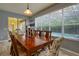 Bright dining room with large windows and pool view at 221 Las Fuentes Dr, Kissimmee, FL 34746