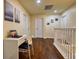 Upstairs hallway with a work desk and hardwood floors at 221 Las Fuentes Dr, Kissimmee, FL 34746