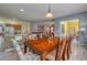 Dining area with wood table and chairs, kitchen view at 221 Las Fuentes Dr, Kissimmee, FL 34746