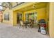 Covered patio with dining area and grill at 221 Las Fuentes Dr, Kissimmee, FL 34746