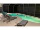 Inviting screened pool with lounge chairs at 221 Las Fuentes Dr, Kissimmee, FL 34746