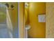 Small powder room with pedestal sink and mirror at 221 Las Fuentes Dr, Kissimmee, FL 34746