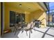 Covered patio with dining table, chairs, and a built-in grill at 221 Las Fuentes Dr, Kissimmee, FL 34746