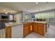 Modern kitchen with a granite island, stainless steel appliances, and ample counter space at 221 Las Fuentes Dr, Kissimmee, FL 34746